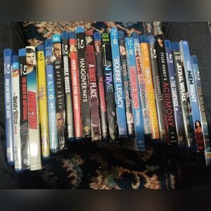 Stack of blue ray and some DVD/blue ray .